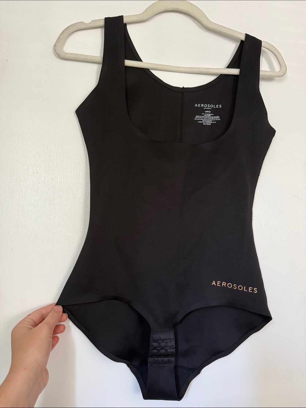 AEROSOLES Black Scoop Neck Bodysuit with rose gold Logo